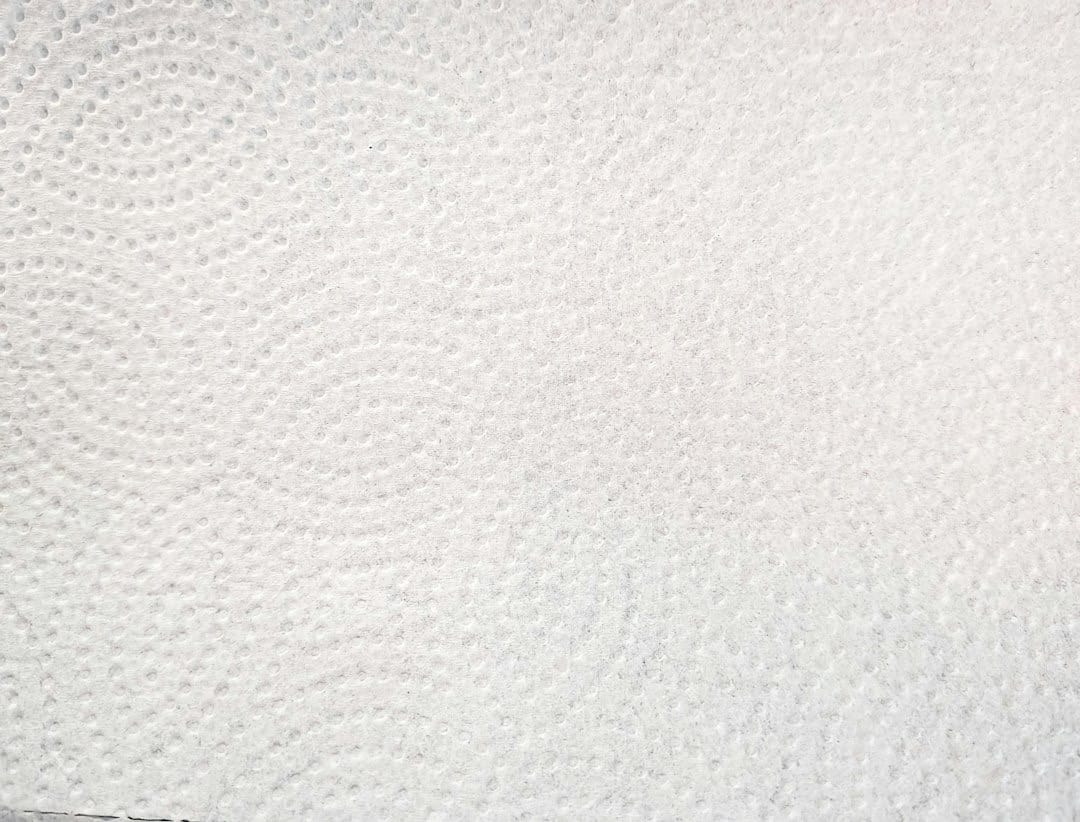 Close up of the embossed dotted texture on a paper towel.