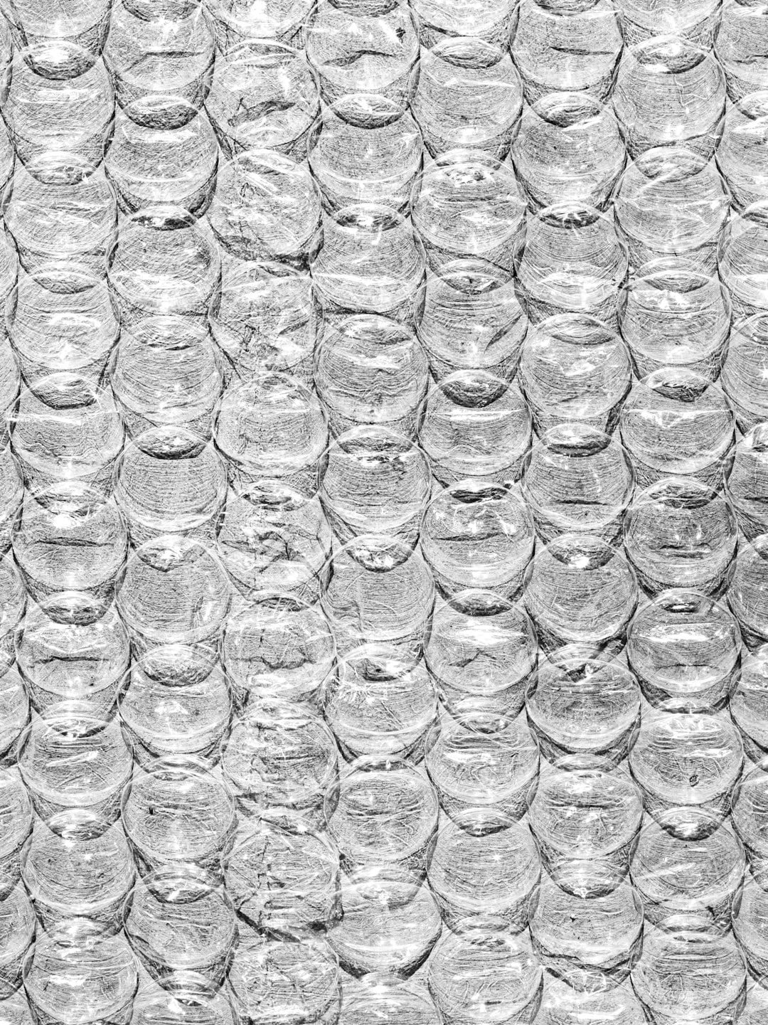 Transparent bubble wrap with air pockets in a grid.