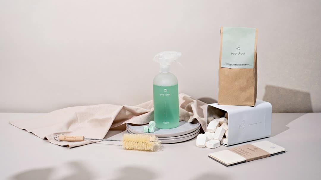 Evedrop eco-friendly cleaning supplies arranged on a white surface.